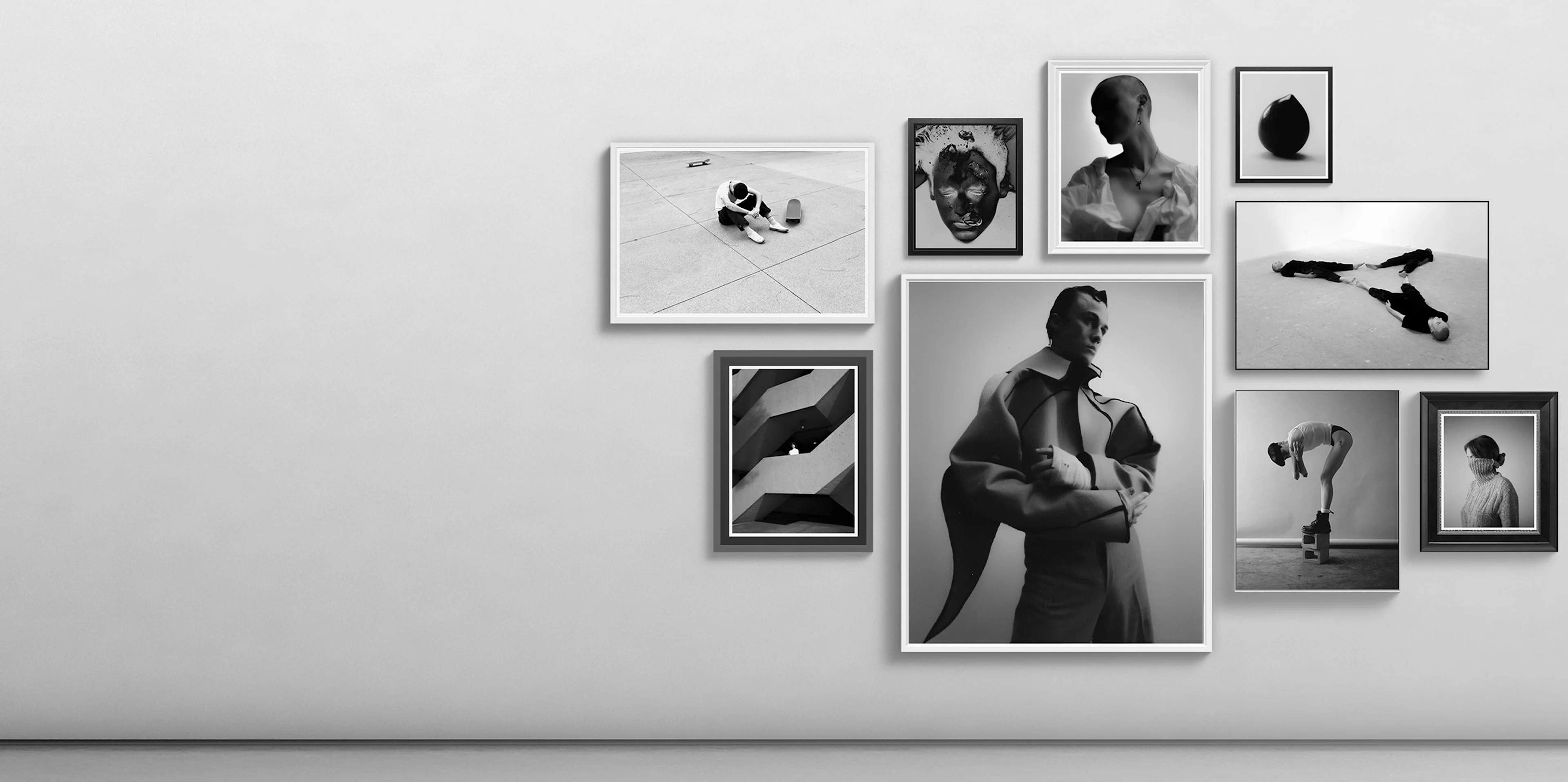 A hanging of framed pictures on the wall showing a variety of our framed products.