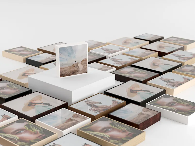 PDP | ArtBox Gift Edition | Product Selector Section | Media #4 Several ArtBox variations lying on a floor, one ArtBox standing on a pedestal in the middle.