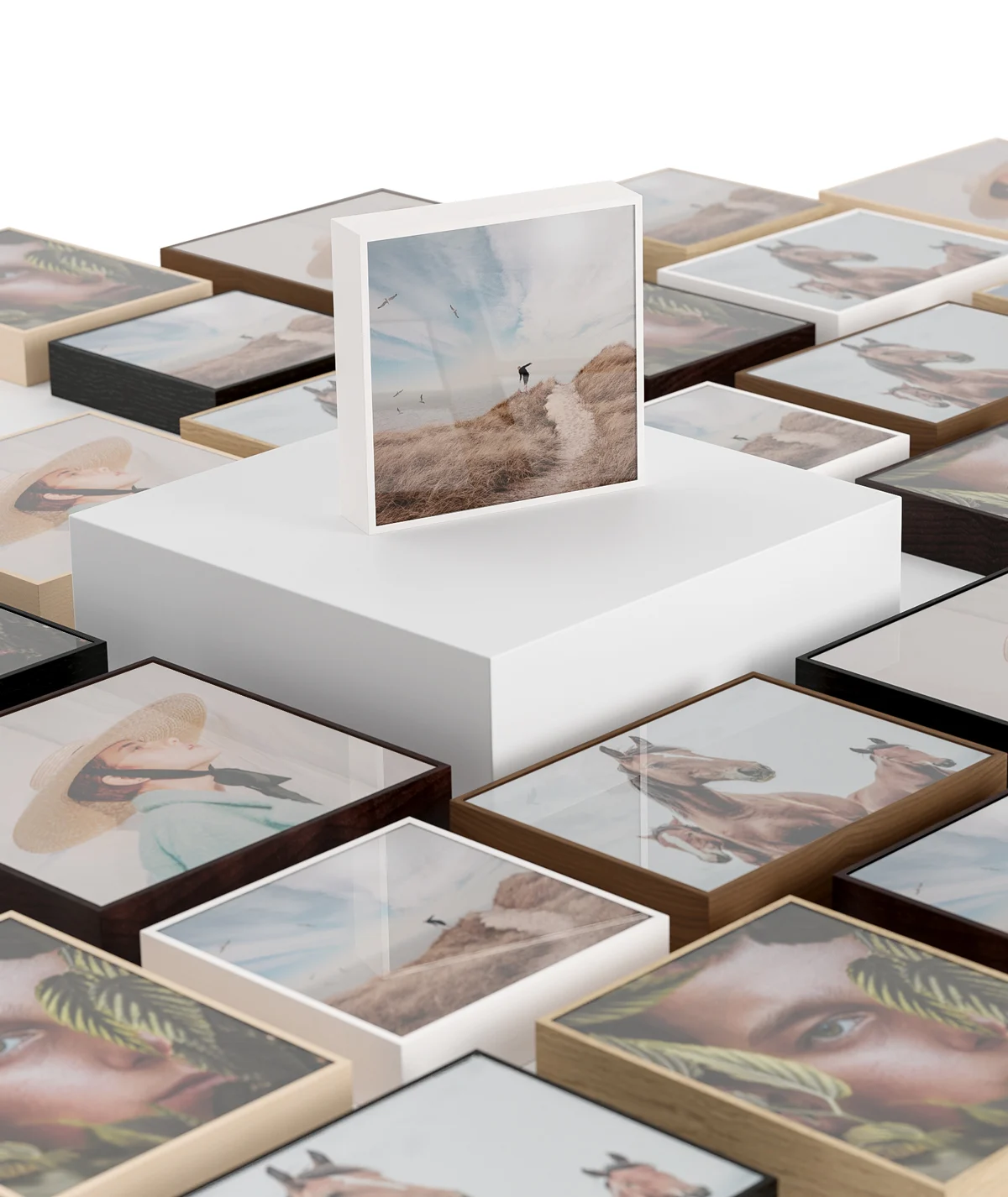 Several ArtBox variations lying on a floor, one ArtBox standing on a pedestal in the middle.