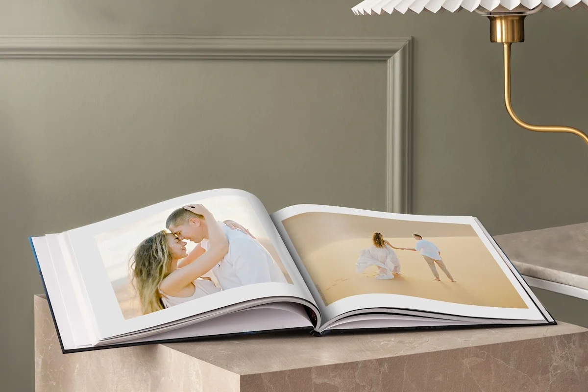 SEA | CDP | Wedding | Big Picture Slider | Product Selection | Slide Coffee Table Book | Image coffee table book with wedding photos printed on it lying on a table.