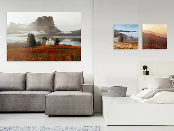 Formats of Photo Print Under Matte Acrylic Glass One large and two small landscape photos as photo prints hanging on a wall under matte acrylic glass.