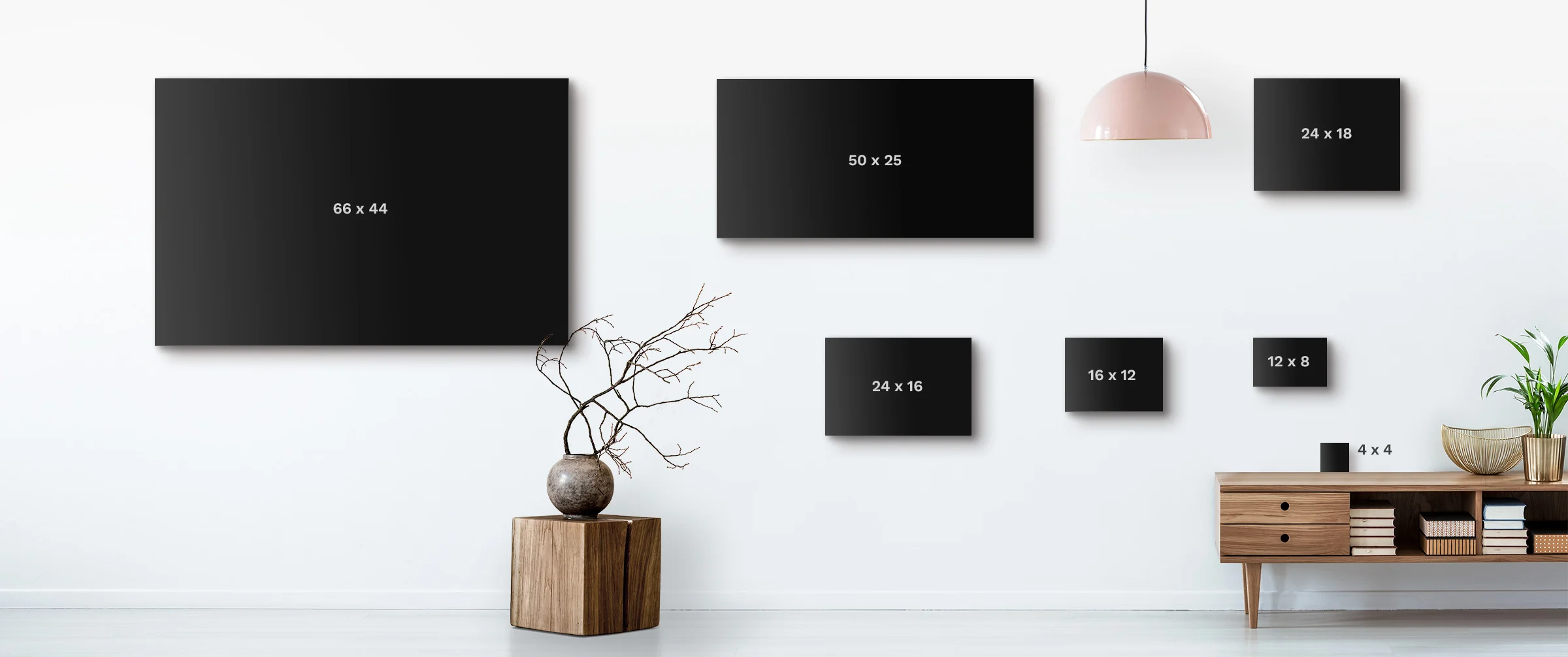 Wall with different sizes of photo frames displayed for comparison.