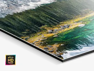 PDP | ultraHD Photo Print On Aluminum Dibond | Product Selector Section | Media #2 Close up of the image of A mountain and a forest reflected in a lake on a ultraHD Photo Print On Aluminum Backing.
