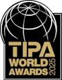 Logo TIPA Banner 2024 TIPA World Awards 2025 logo with golden lettering and stylized globe.